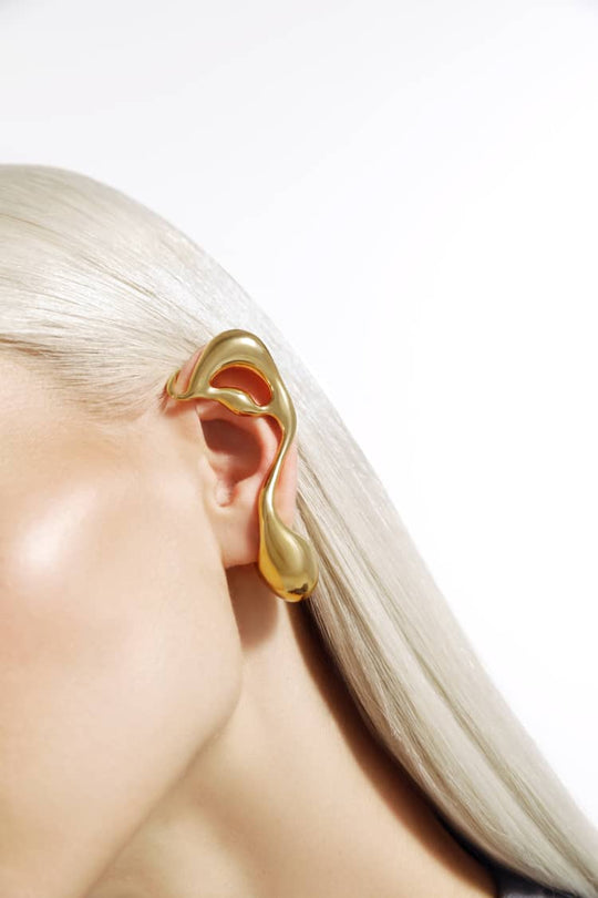 asymmetrical liquid earring in gold
