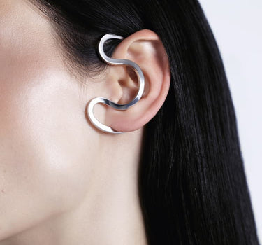 Silver ear cuff around the ear