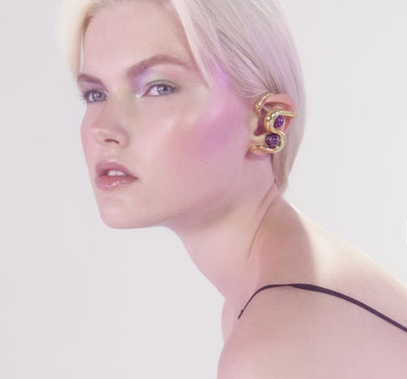 Gold ear cuff with amethyst stone