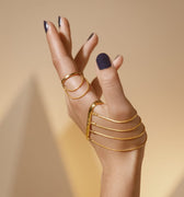 Gold wrap around ring set with chains