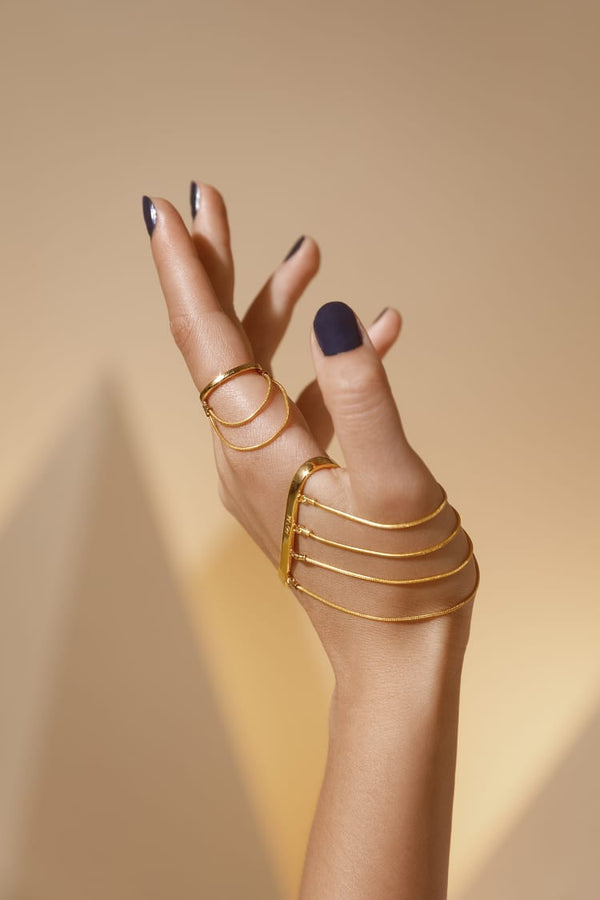 Gold wrap around ring set with chains