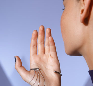 Silver hand ring with thumb chain