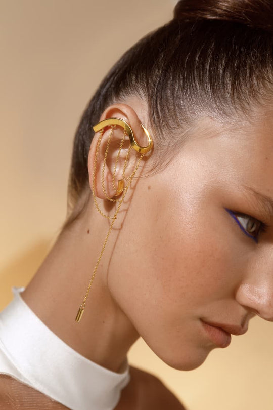 Gold draping ear cuff with pendant