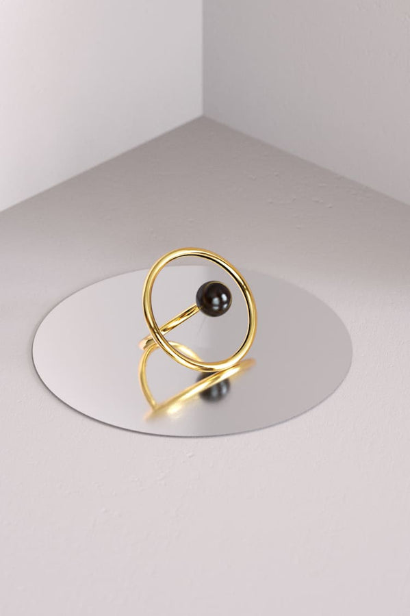 Gold ring with black sandal wood stone